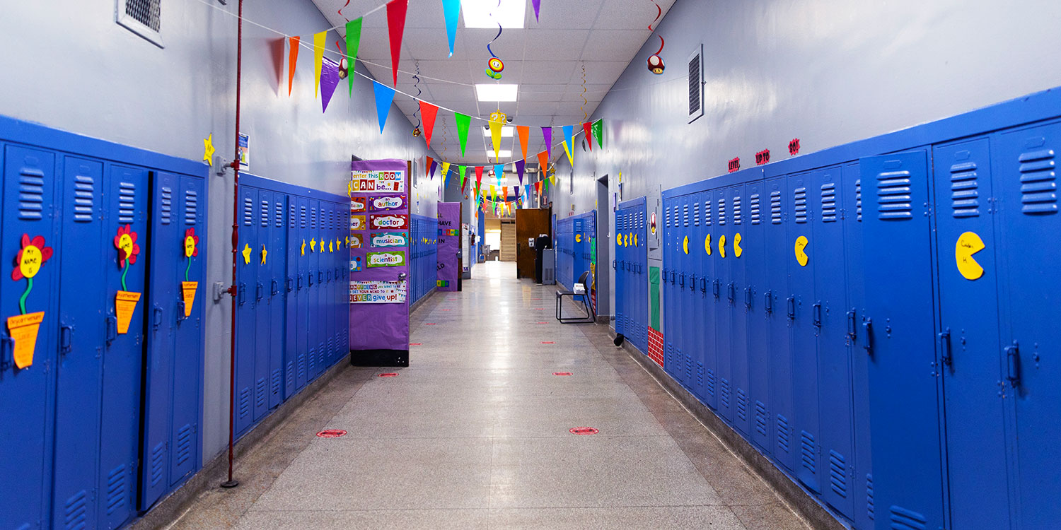 School hallway with lockers and decorations.